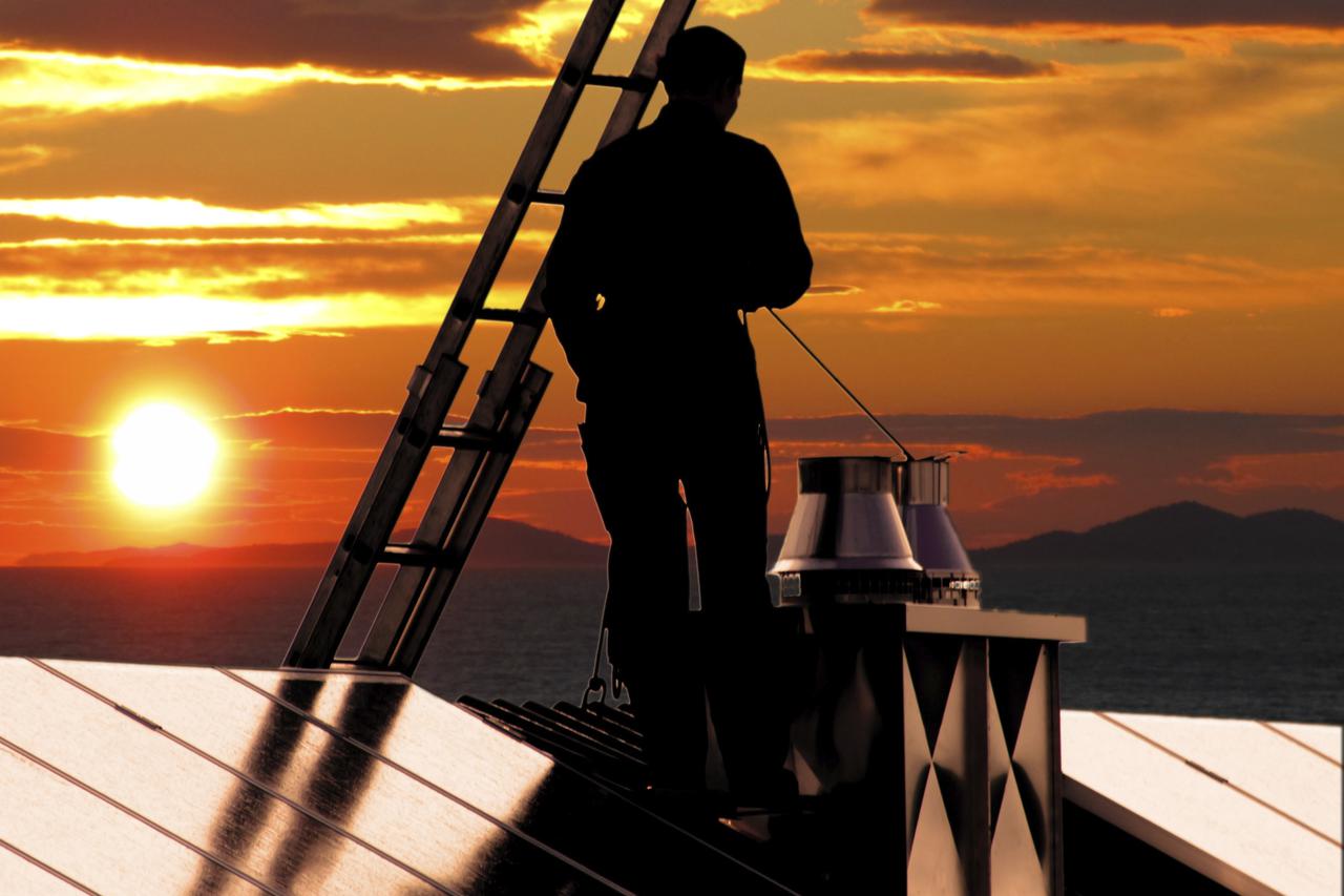 chimney sweeper on sunset